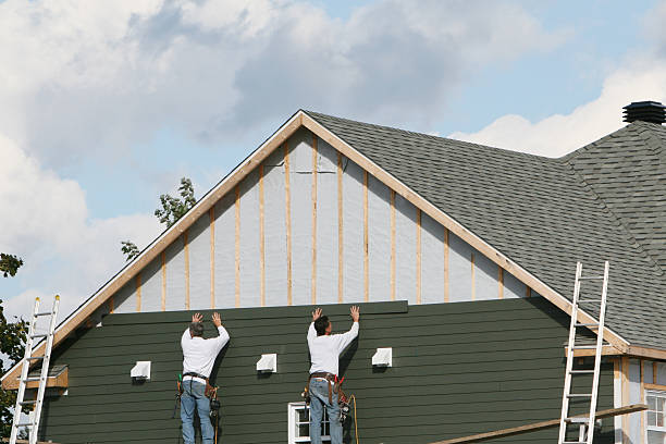 Professional Siding technician working in Kings Park, VA